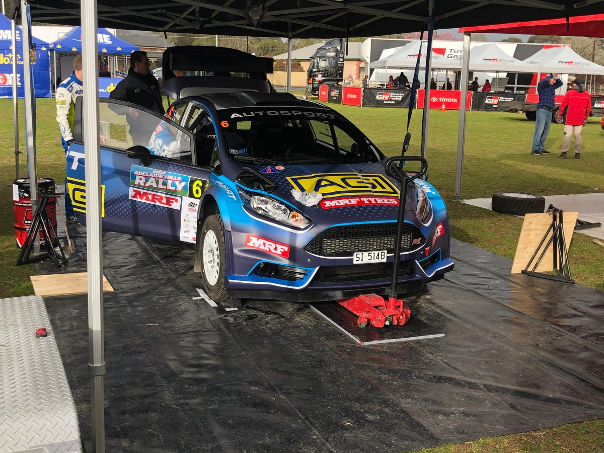 How Custom Pit Mats and Garage Mats Elevate Your Professional Image